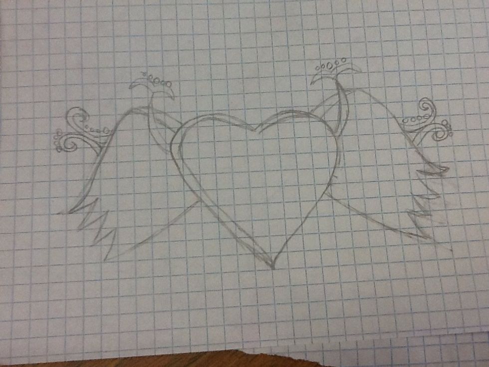Draw the "mustaches" on the "horns" and the the other pretty designs right by the wings...don't forget the circles