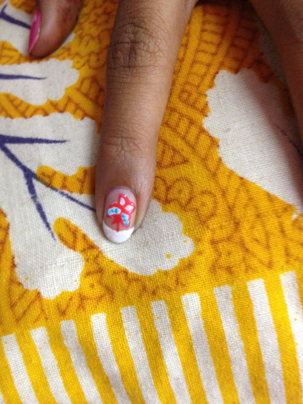 Draw the outline with pink and put dots with blue jus to add a few details