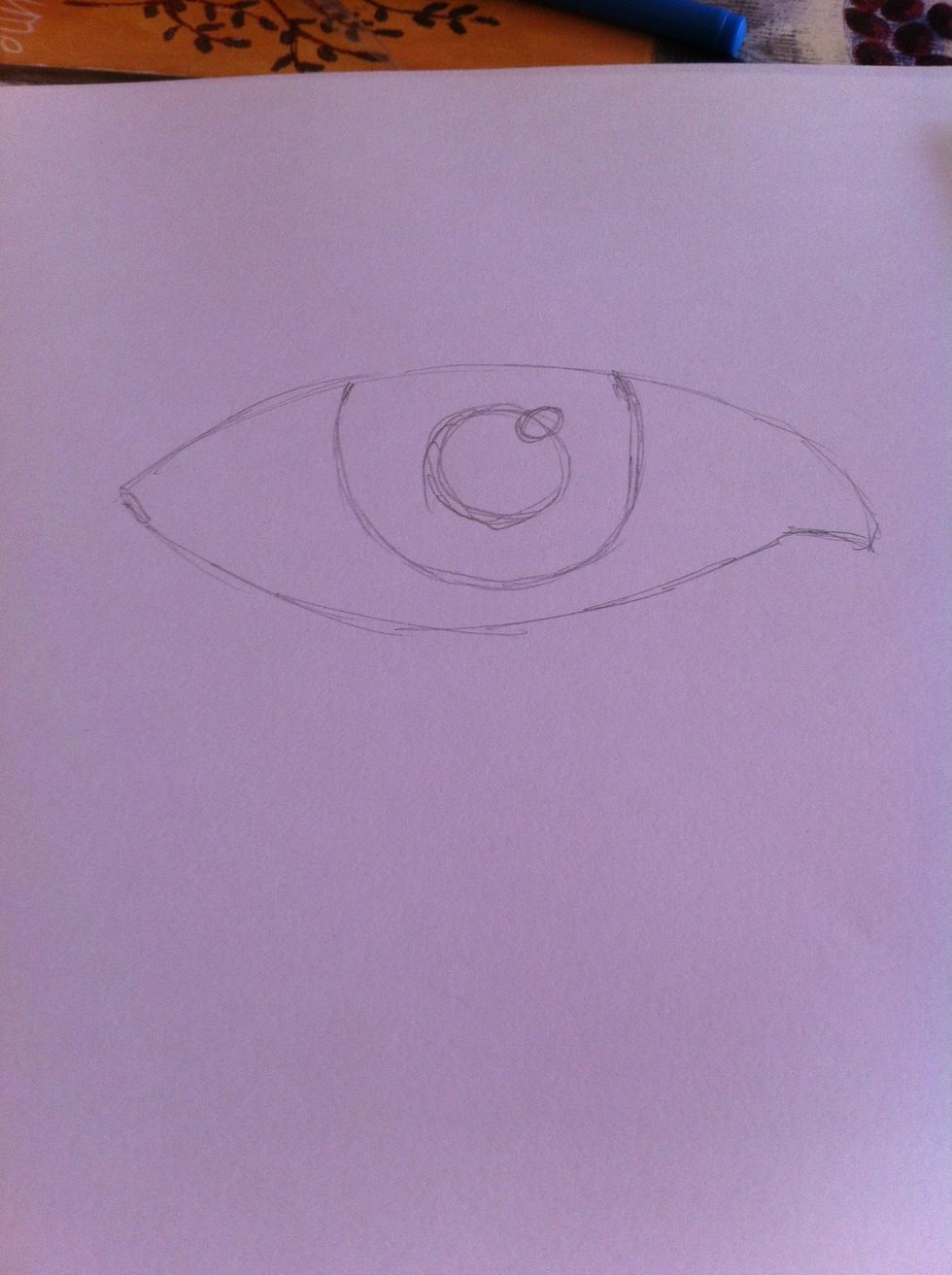 Draw the pupil with a little reflection if you want one (it looks better with one )