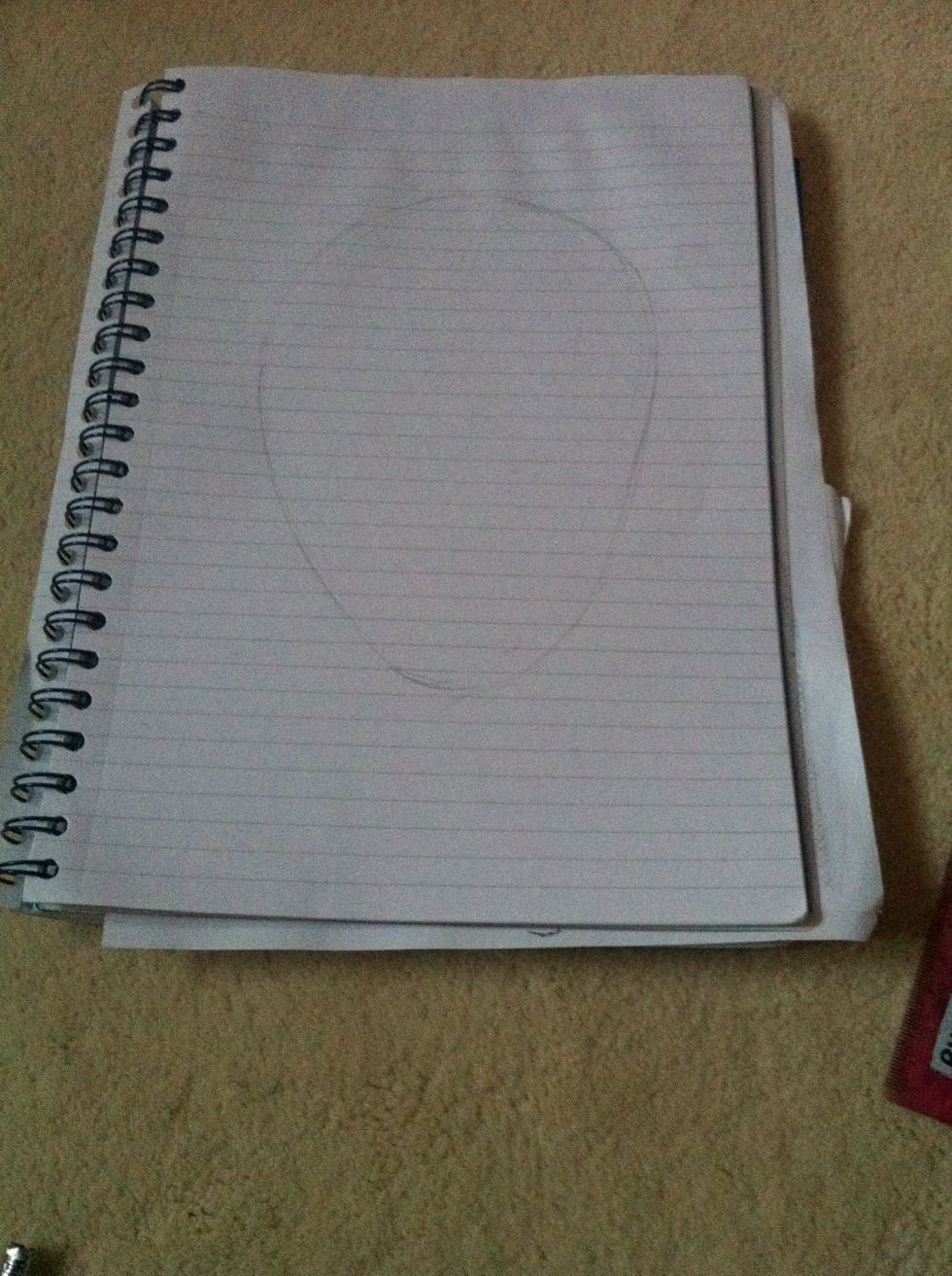 Draw the shape for the head. It looks a bit like an upside down egg shape