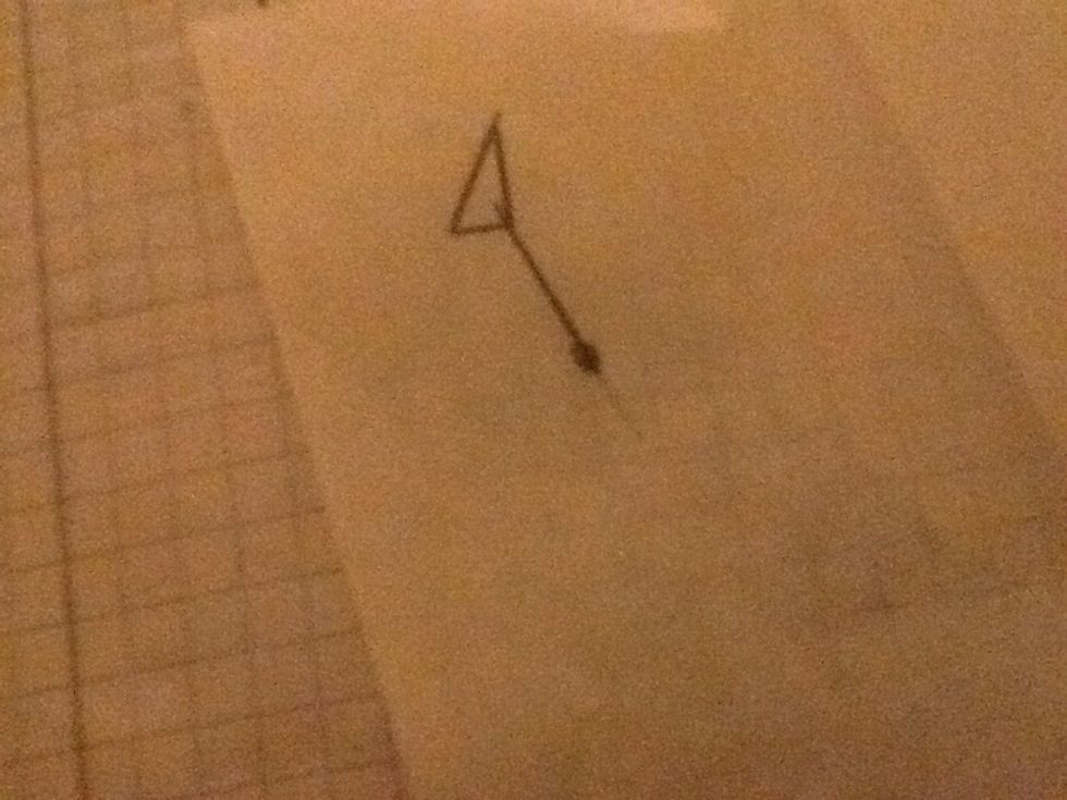 Draw the shape on a piece of tracing paper, draw the line and the dot.