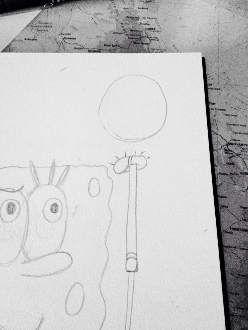 Draw the soccer ball above his right foot!
