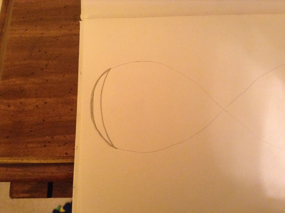Draw this shape on the end of the infinity sign