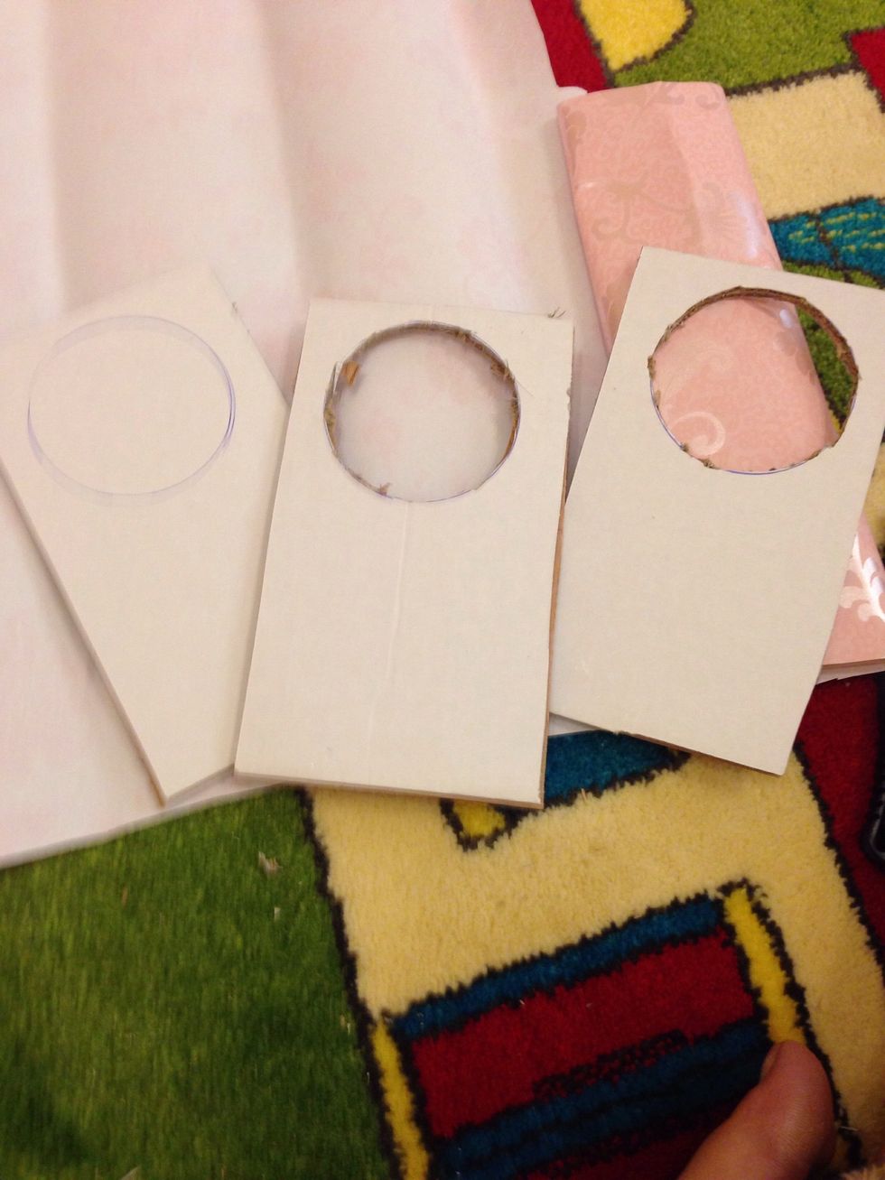 Draw this shape with a circle inside on a card board or chart paper.(make sure whatever u use i thick and strong) then cut out the shape with cutter. Take out the circle too