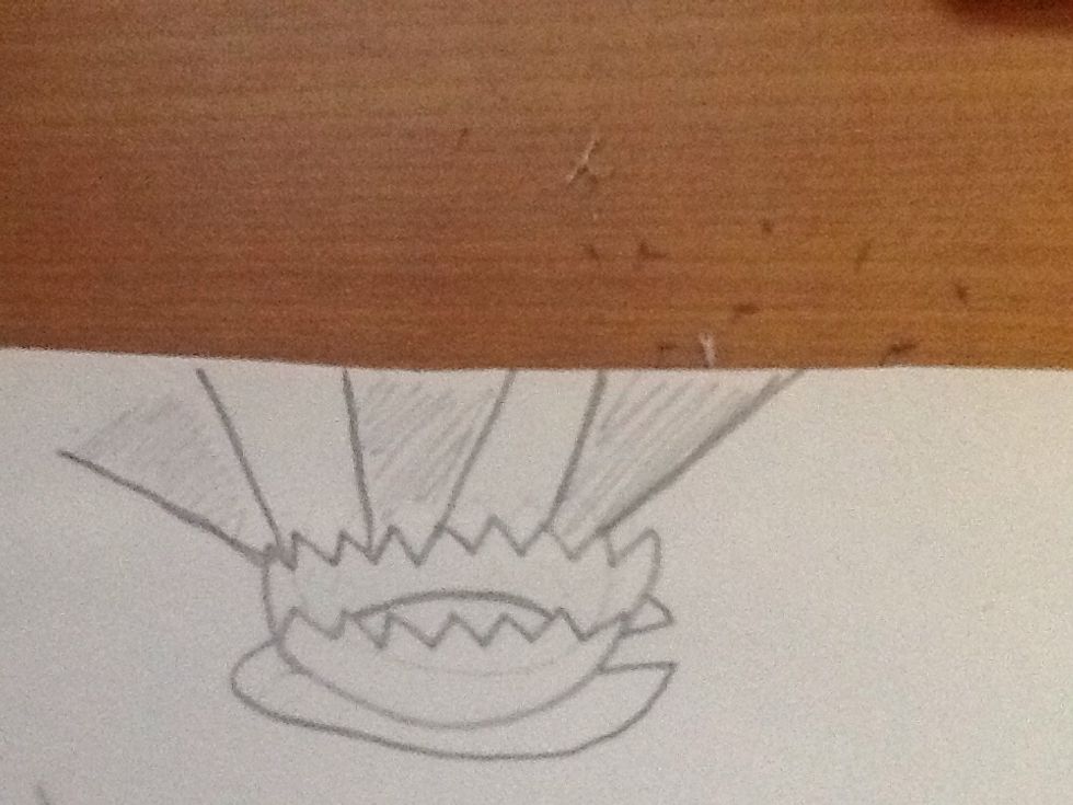 Draw three beams of light coming from the lily pad flower in V shapes; space them and then shade them lightly.