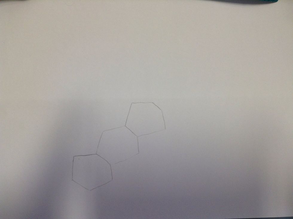 Draw three hexagons on your page.