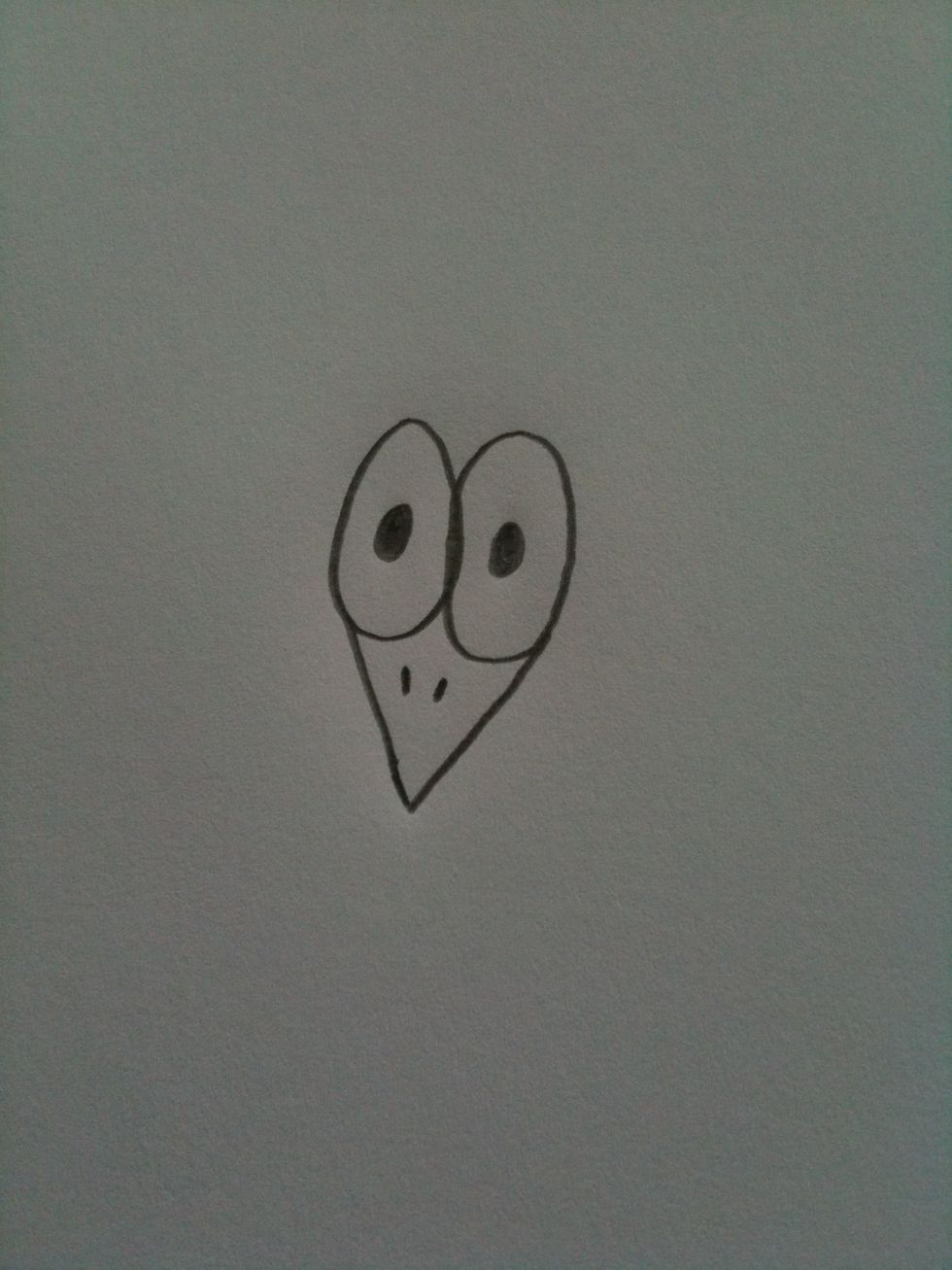 Draw to little lines like so to make them look like nostrils.