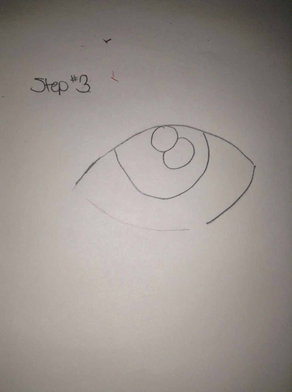 Draw two circles inside the medium sized circle