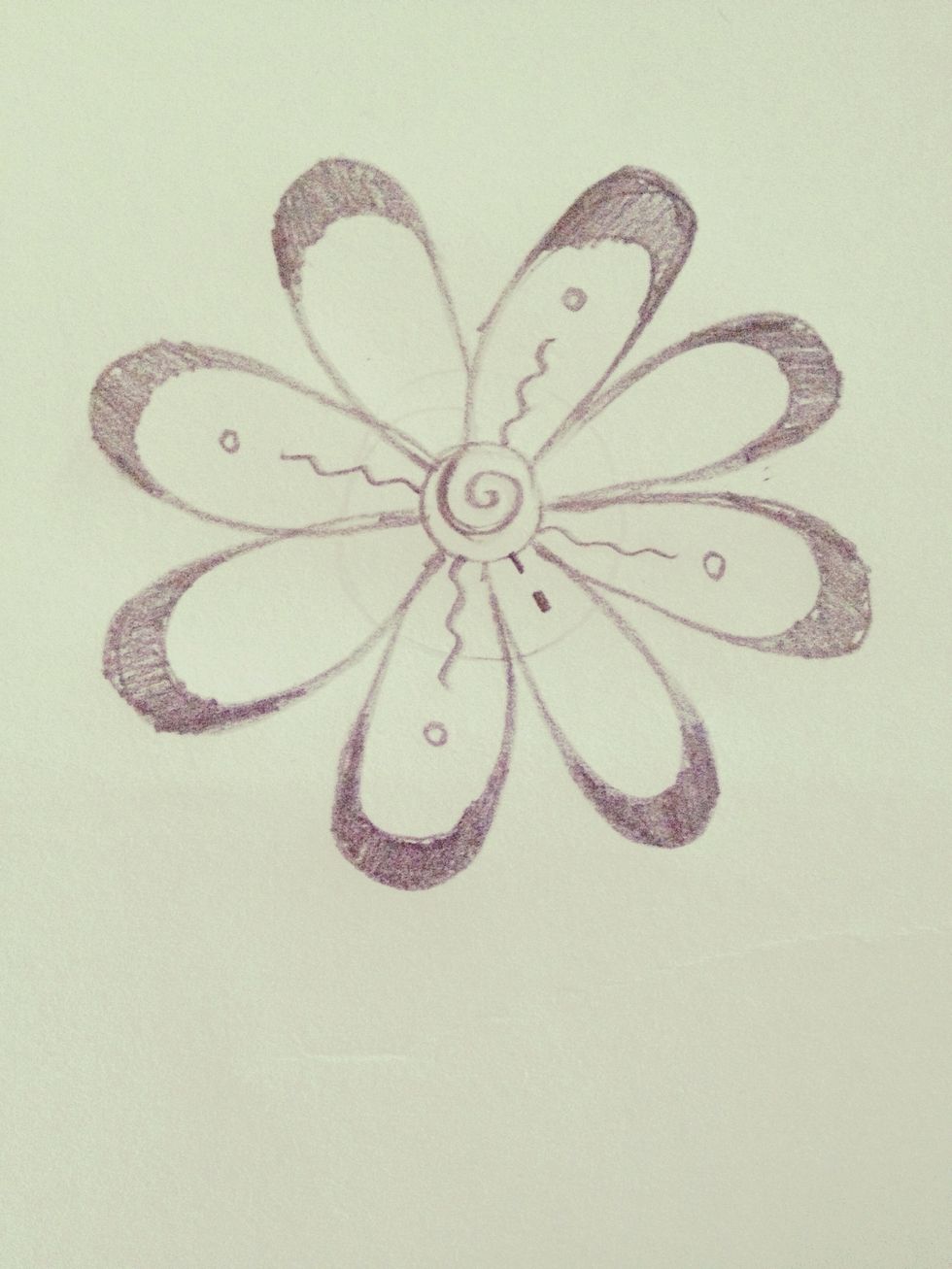 Draw two dashes from the base of the inner petal, like this.