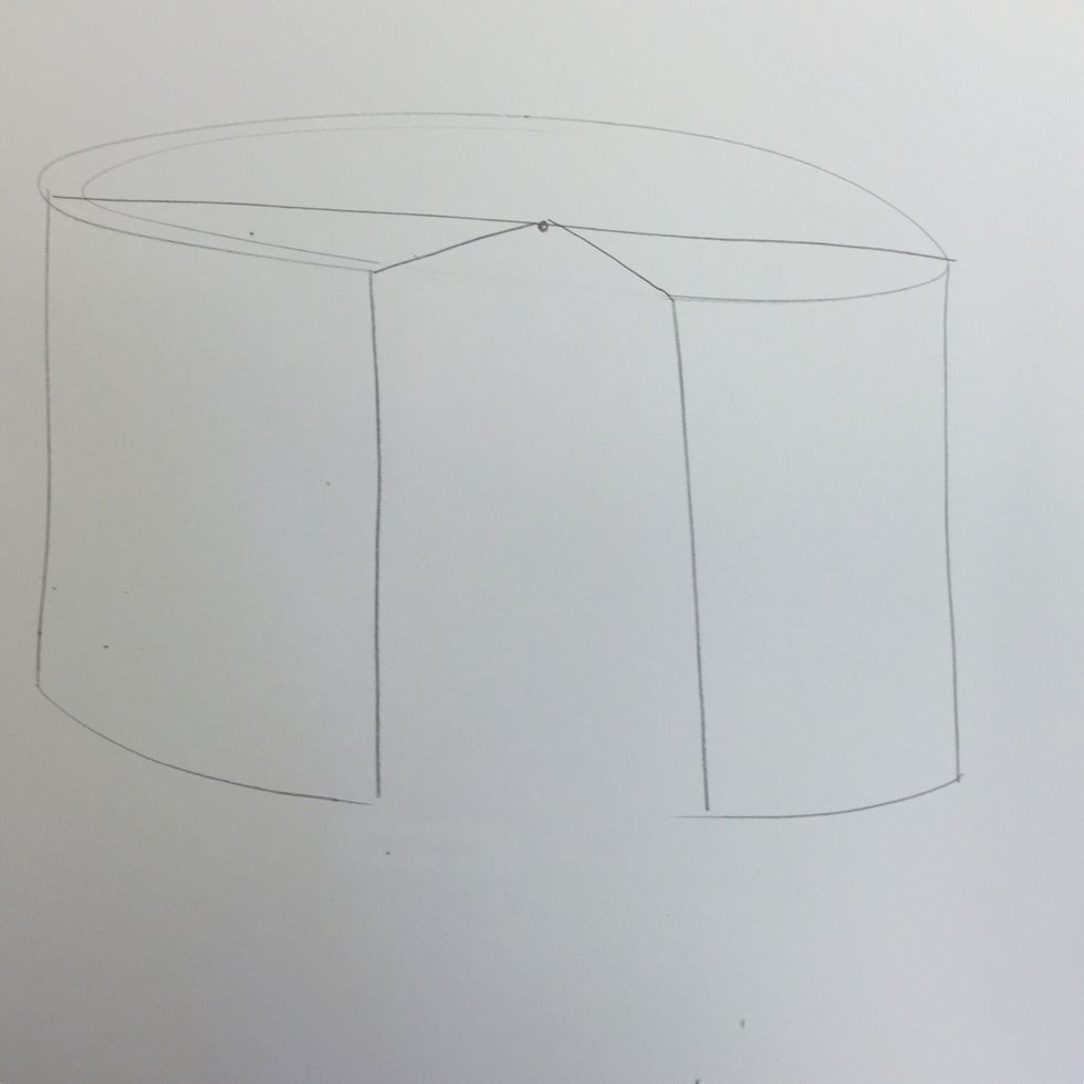 Draw two diagonal lines from the top edge of the cake back to the dot.