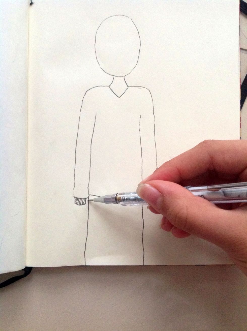 Draw two lines for the trouser...you don't need to draw them very straight because the trousers are not straight.