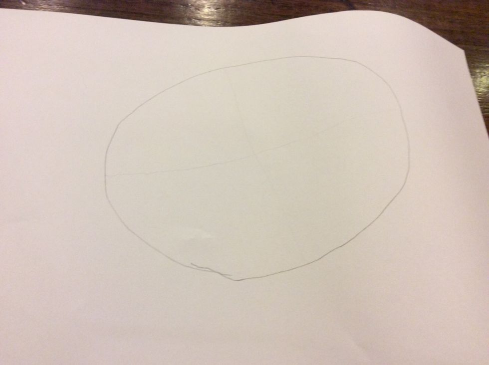 Draw two lines in the oval.