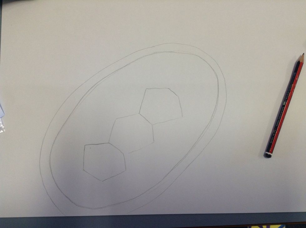 Draw two ovals around the three hexagons.