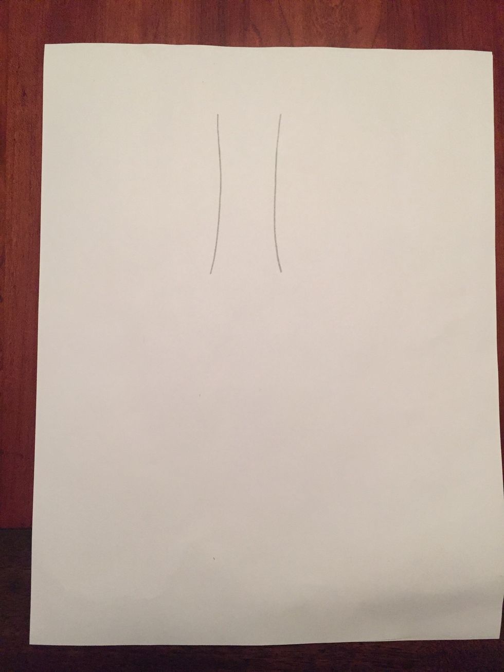 Draw two parallel lines towards the top of your paper for the neck of the bottle.