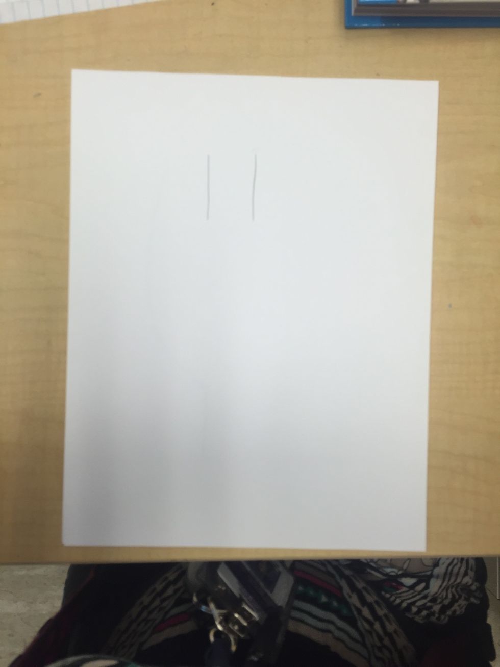 Draw two parallel lines towards the top of your paper for the neck of your bottle.