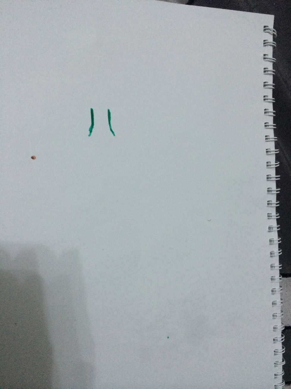 Draw two short lines with a little curve at the bottom