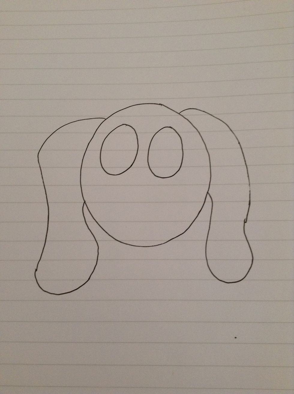 Draw two smaller circles inside the bigger circle. These will be its eyes.