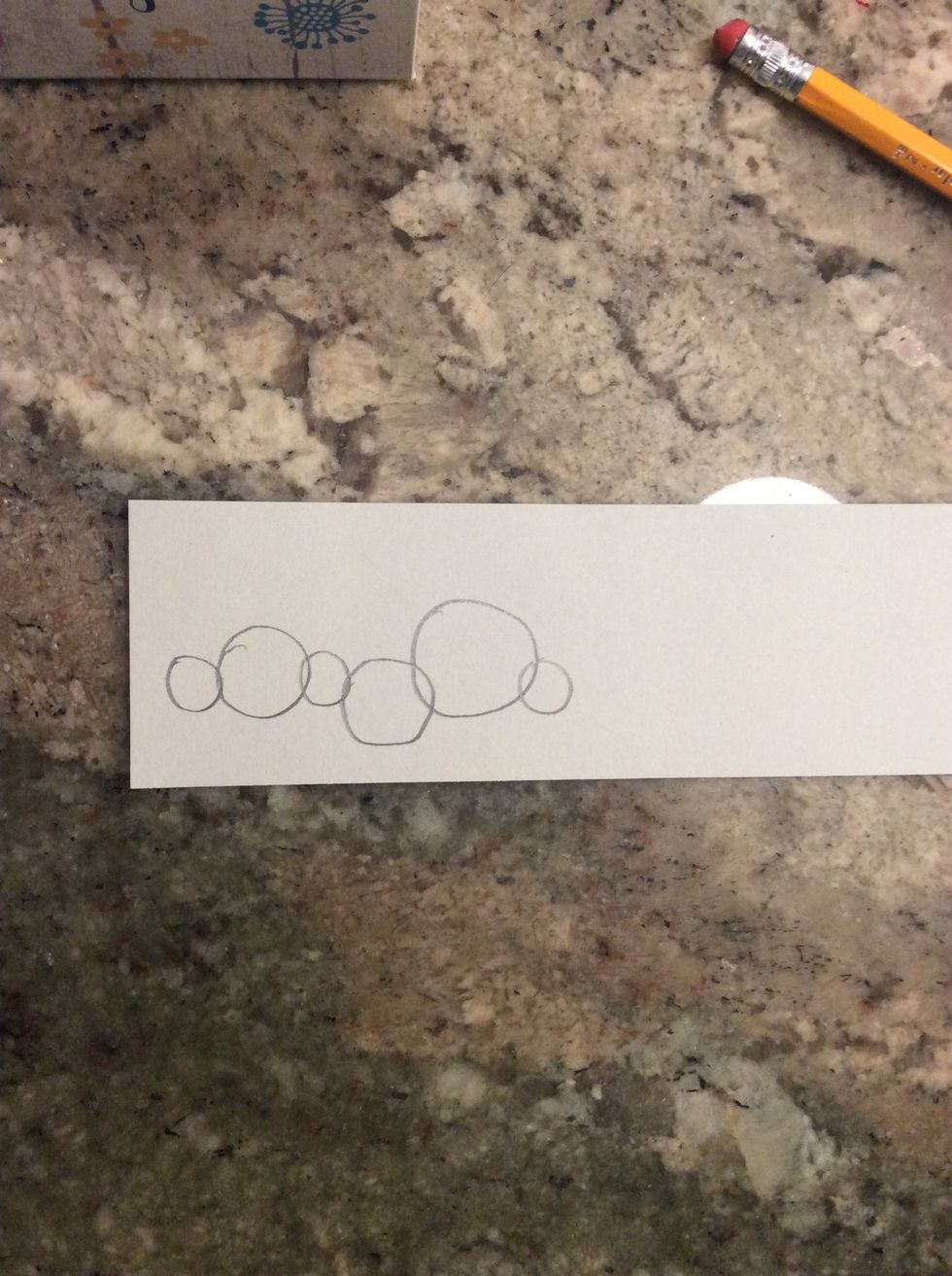 Draw various size circles on your cardstock/ stencil material.