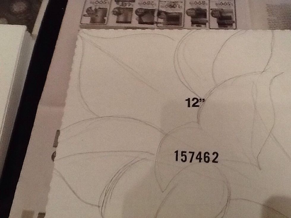 Draw your image on a pizza box.  Make sure that your image goes off all three sides.