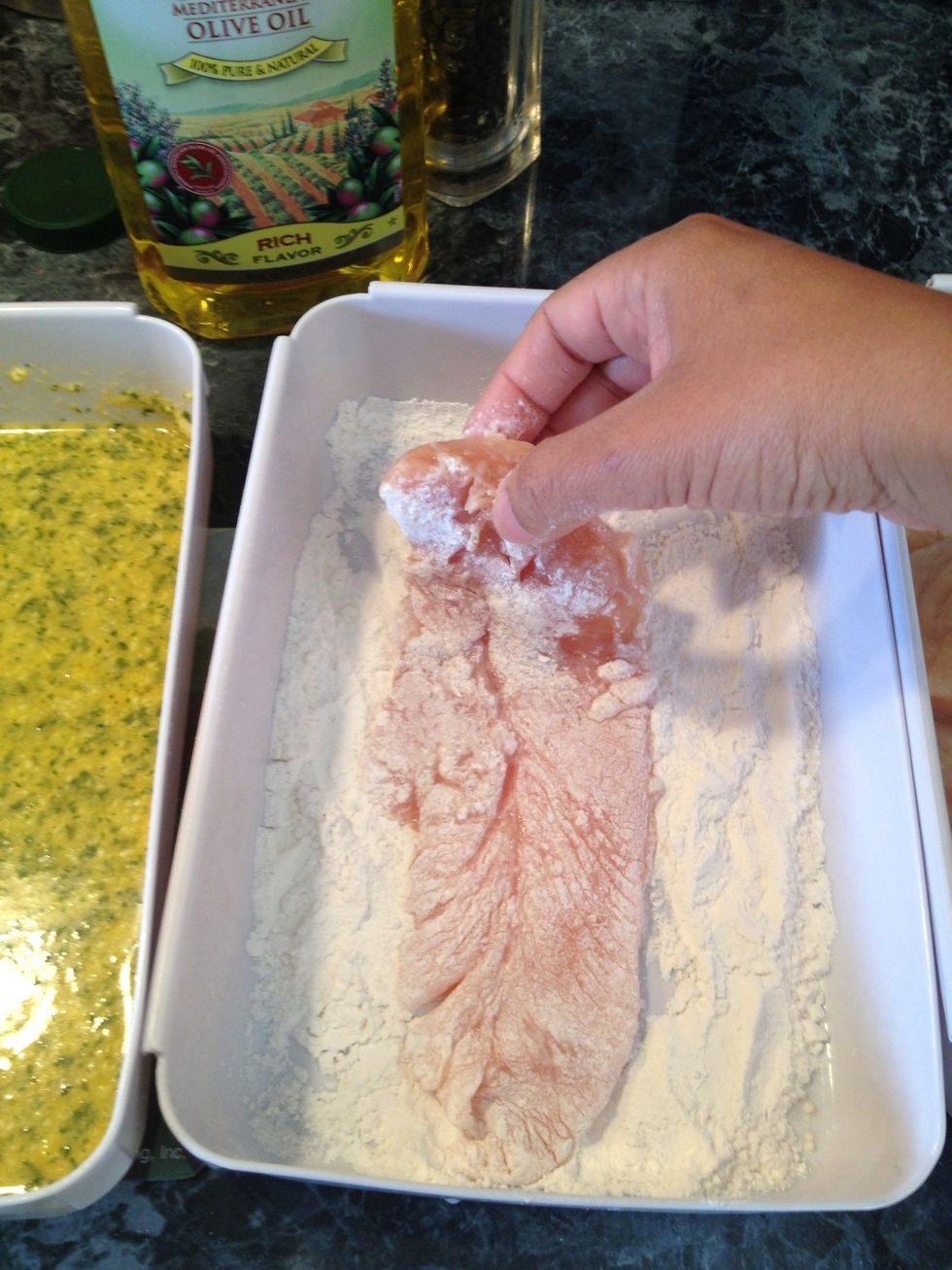 Dredge the chicken in the flour.