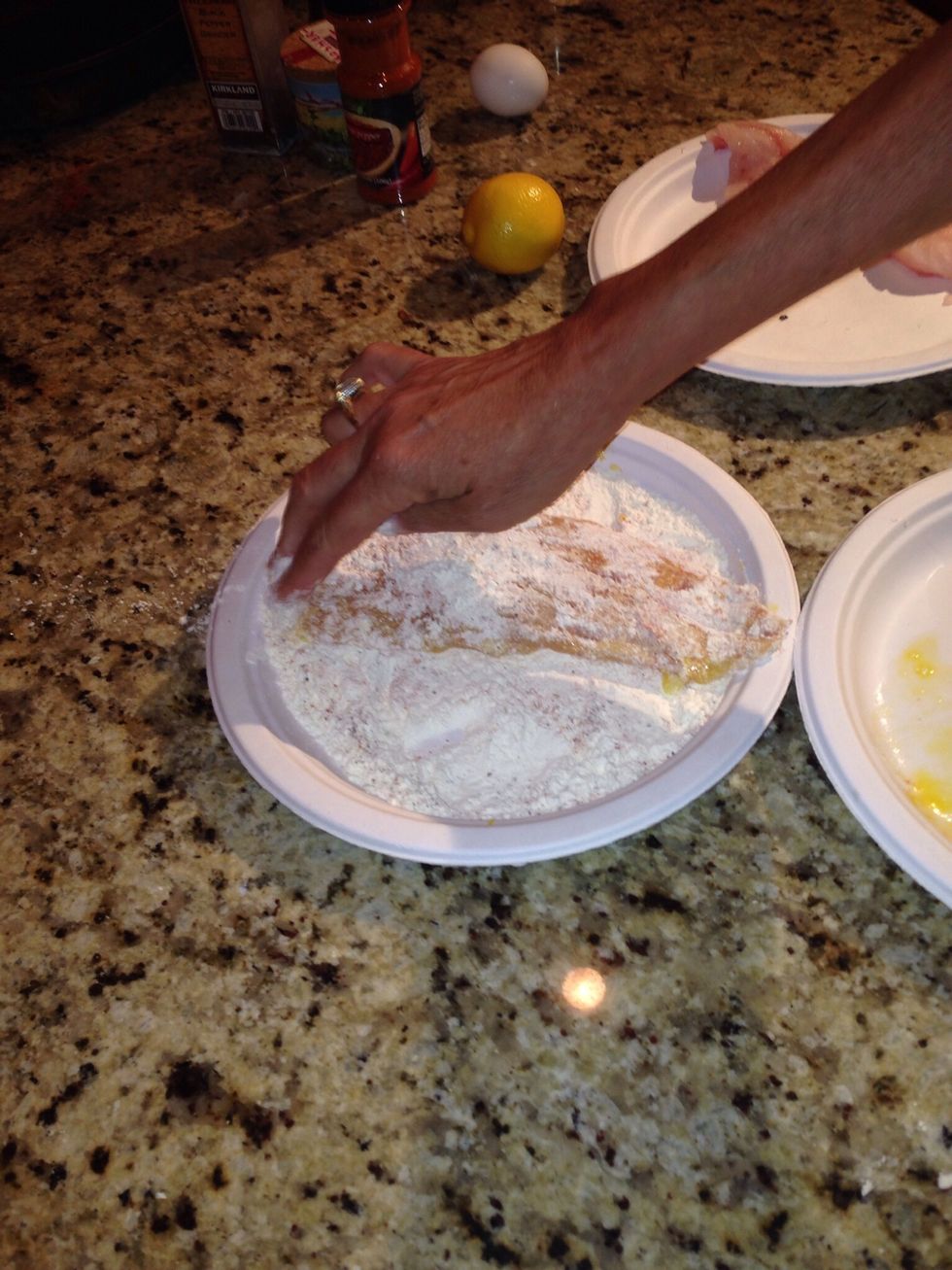 Dredge the fillets back through the flour. Heat skillet over med to med hi with a little olive oil and 1tsp of butter.