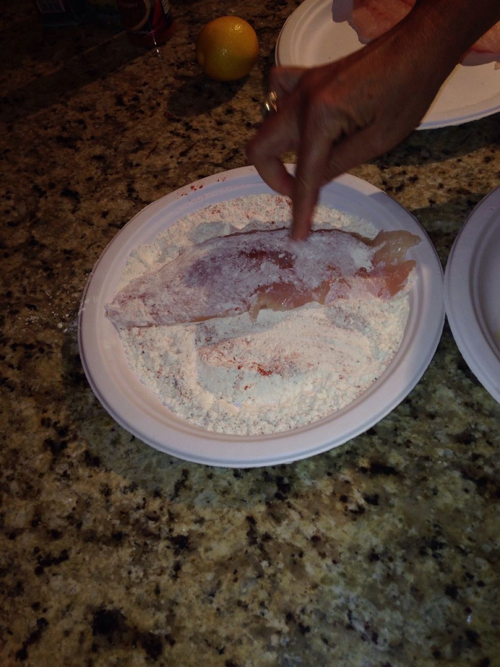 Dredge the fillets thru the flour.