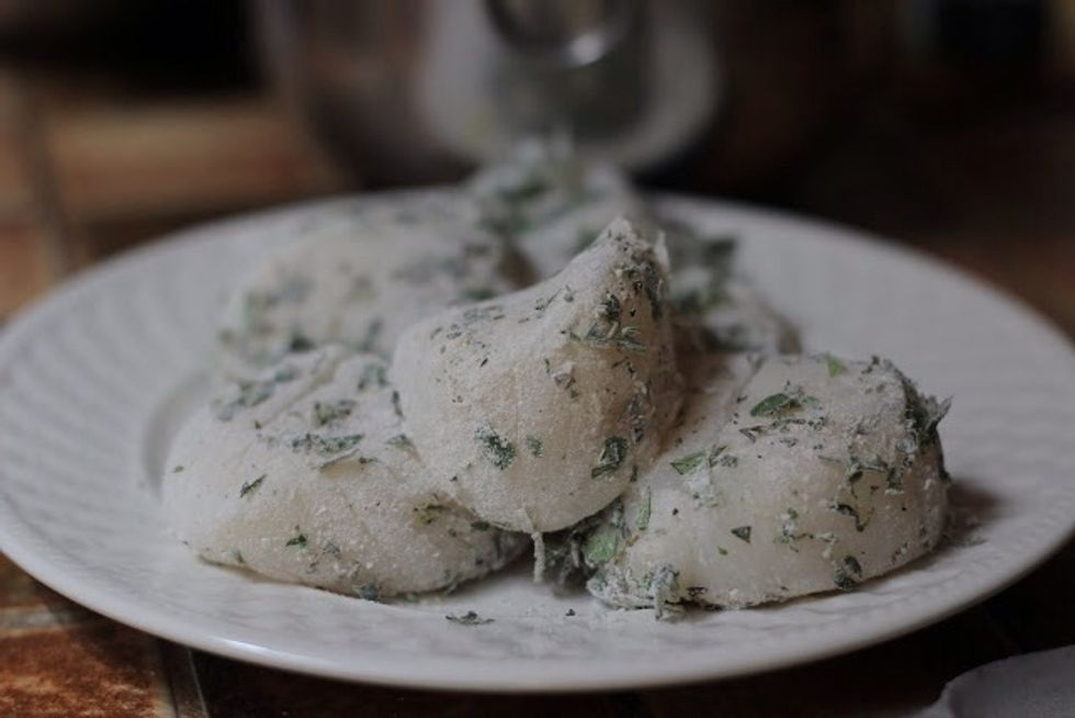 Dredge the scallops in the flour mixture, make sure they're well coated.