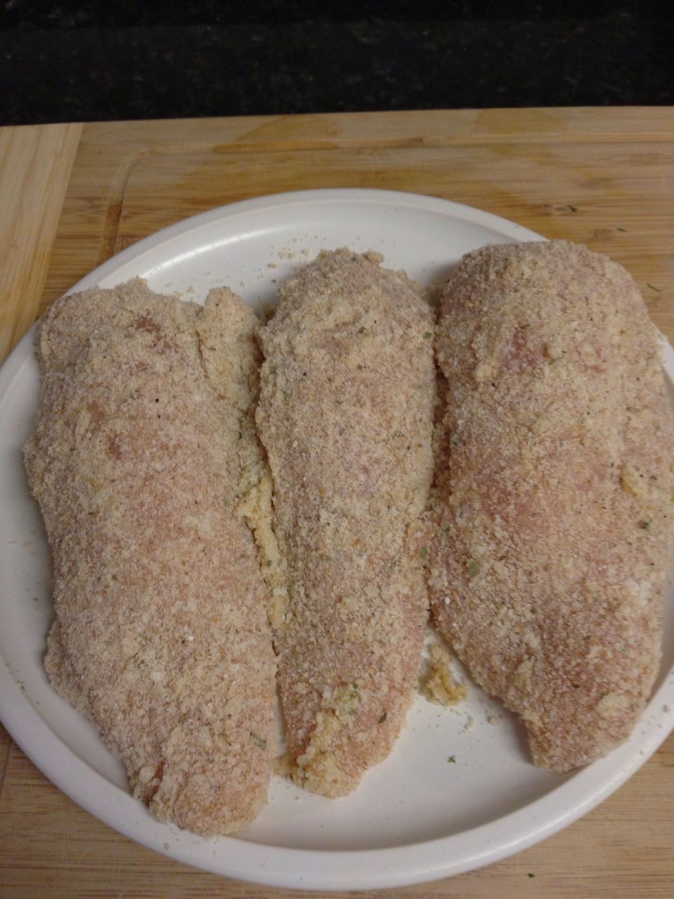 Dredge the stuffed chicken in the egg bath, then in the Parmesan breadcrumb mixture. Set aside.