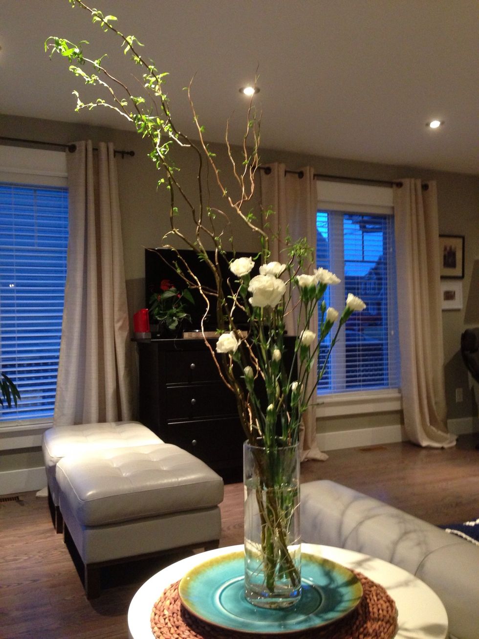 Dress up a cheerful looking plate with a vase, one or two willow branches and a couple of carnation flower stems. I love the colours teal and green for spring and carnations are easy and cheap to buy.