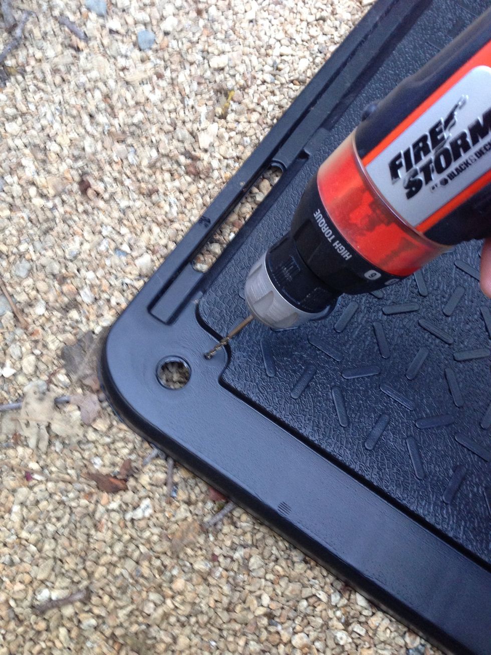 Drill a 1/8" pilot hole at a slight angle.