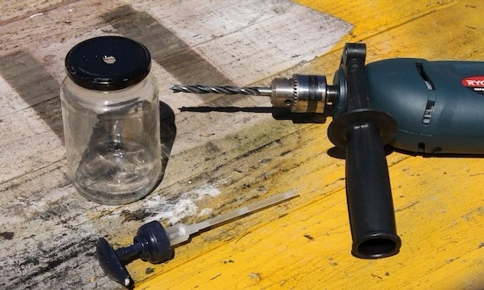 Drill a hole in the top of your jar lid. Use a large drill bit size for this and one intended for use on metal.