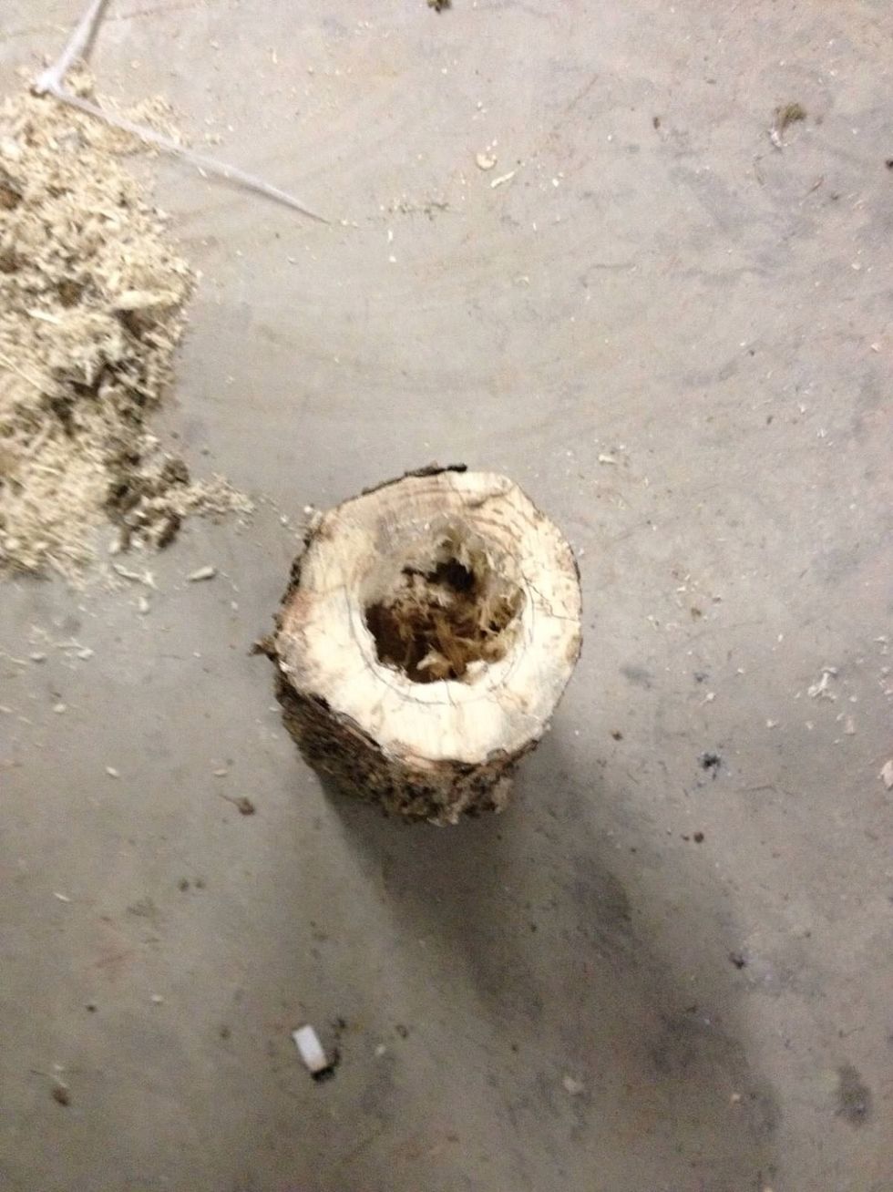 Drill a hole in the top piece big enough to fit the top of the container in. Smooth out holes with a dremel tool.