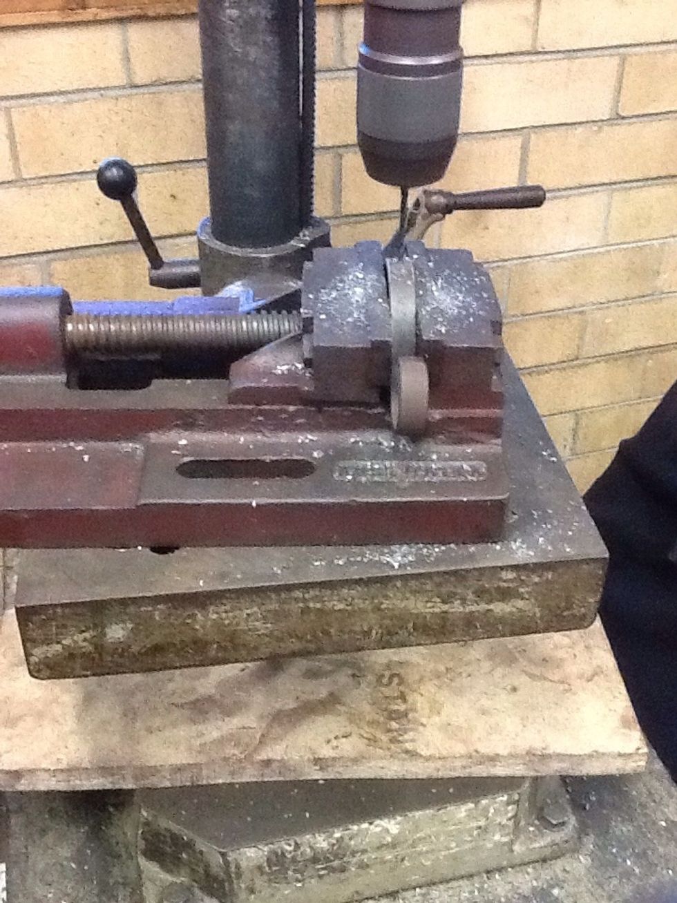 Drill a hole where you marked using the drill press, don't forget to wear safety glasses