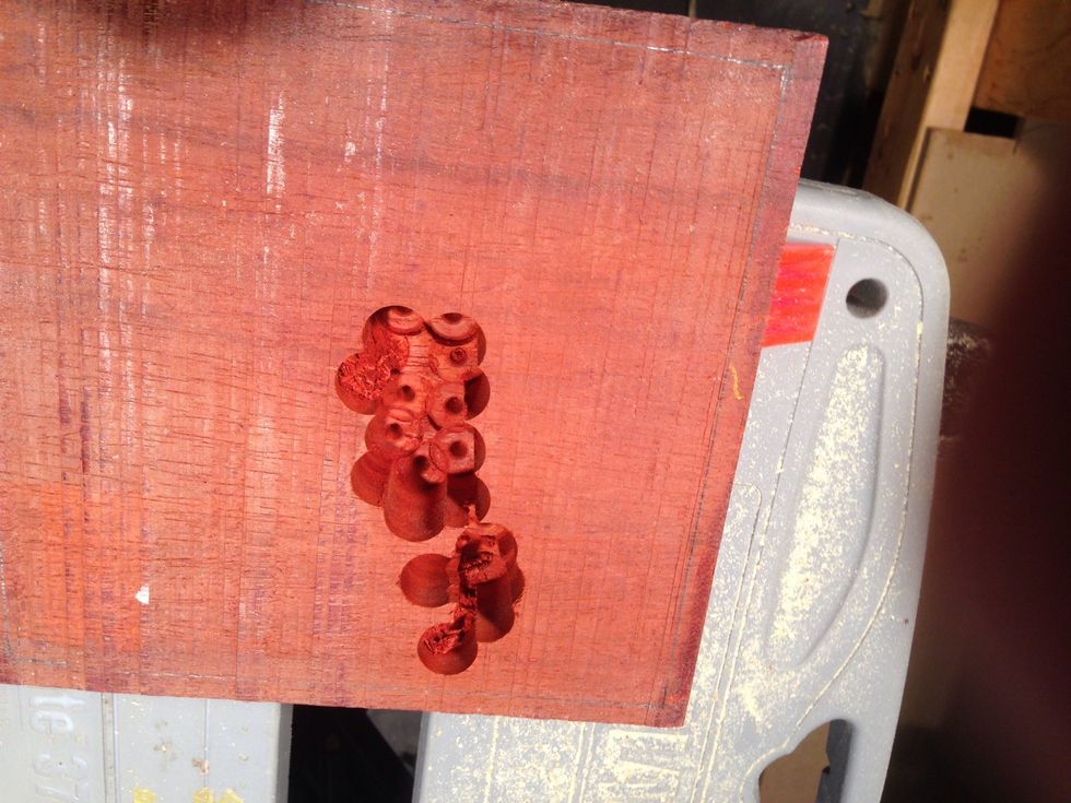 Drill and drill some more. Set the depth so it doesn't go alway through.