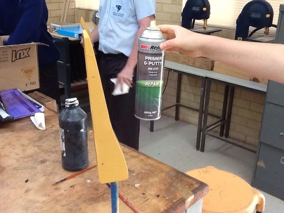 Drill axel wholes then spray a coat of wood putty and sand then repeat