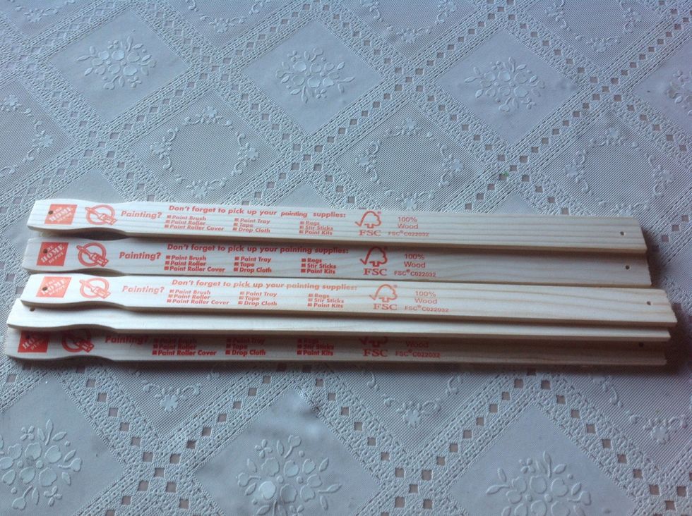 Drill holes (in the middle) on either side of each paint stick. Make sure you get bolts to fit the size hole.
