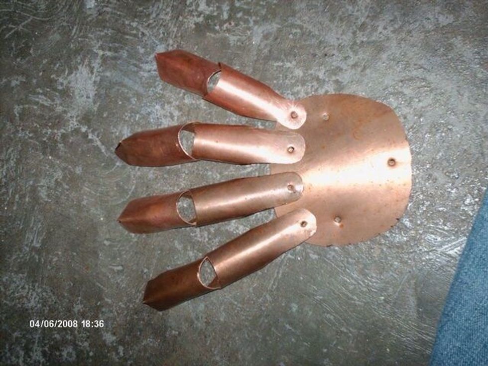 Drill holes on the bottom of the stalls, then put the whole armature over your hand (inside the leather glove) and adjust the backplate to your comfort, then mark on it where the new holes should go.