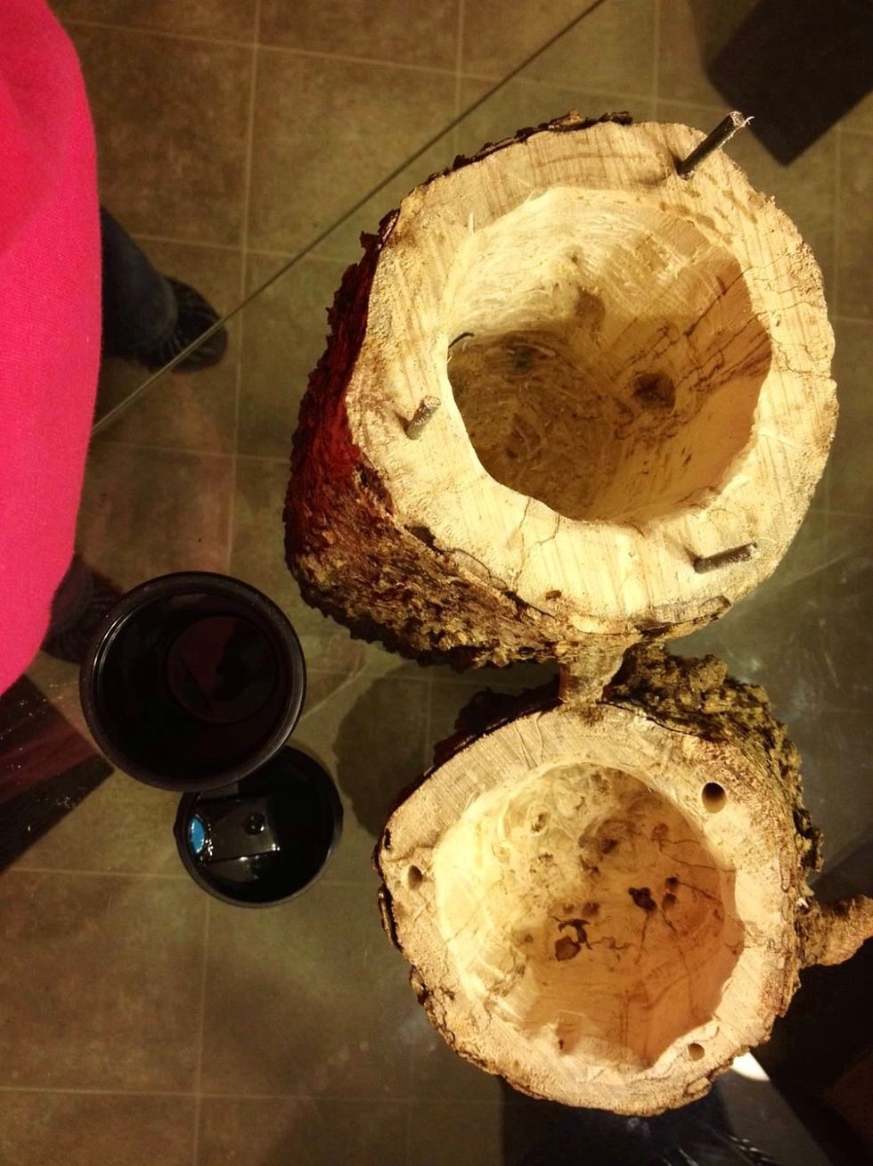 Drill small holes in the bottom piece around the edges and insert small metal rods. Drill holes in the top at the exact locations as the rods on the bottom. This holds the top on when put together.