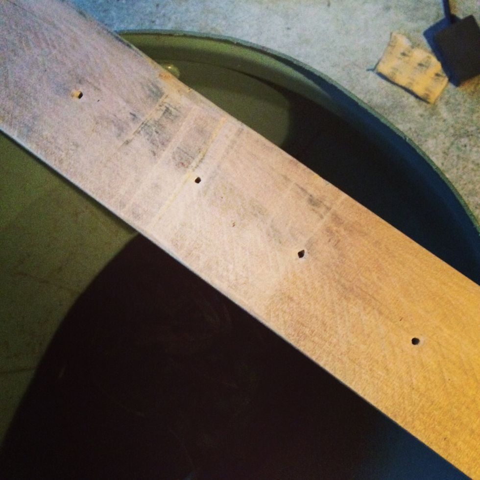 Drill the holes into the wood. Once the holes are drilled then sand the wood.