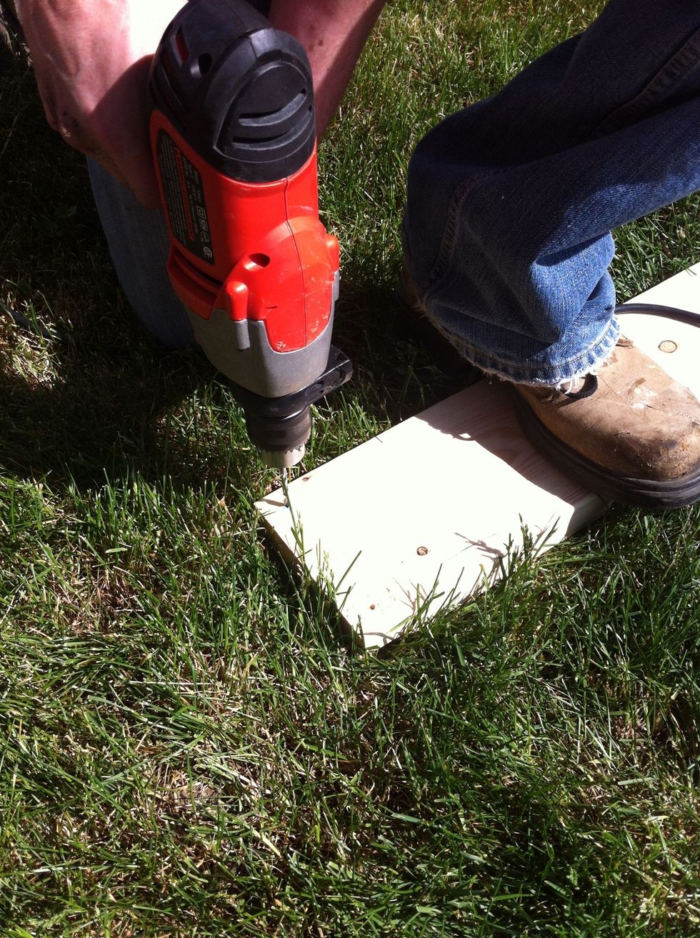 Drill your pilot holes. Try and make sure they go through straight, perpendicular to the top of the board. Both ends of all the 2x6x8 should have two pilot holes.