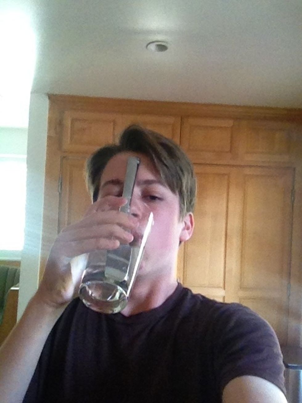 Drink the water with the handle of the knife on your nose to the best of your ability. The taller the glass and the shorter the knife, the easier this step is.