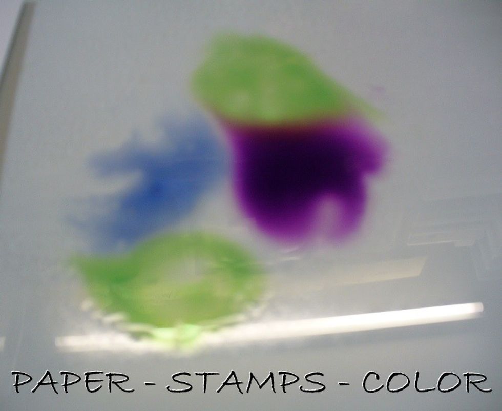 Drip some ink onto your craft sheet, and mist with water.