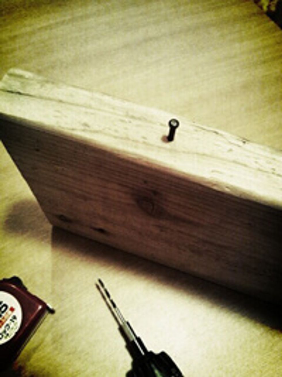 Drive a pin into the edge of the board.