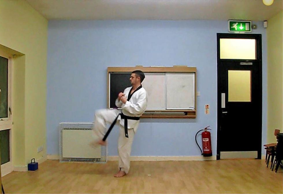 Drive the rear leg forwards. Keep the body upright, with your weight transferred to the standing foot for balance. Keep the knees close together as you bring the kicking leg through.