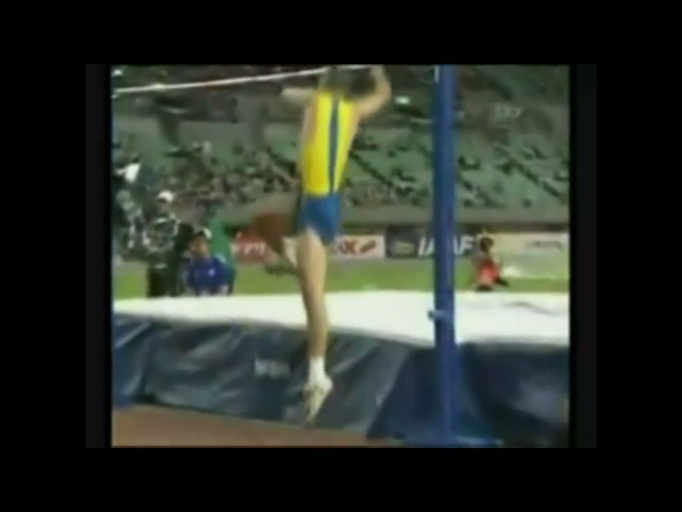 Drive your inside knee and both arms up for height.