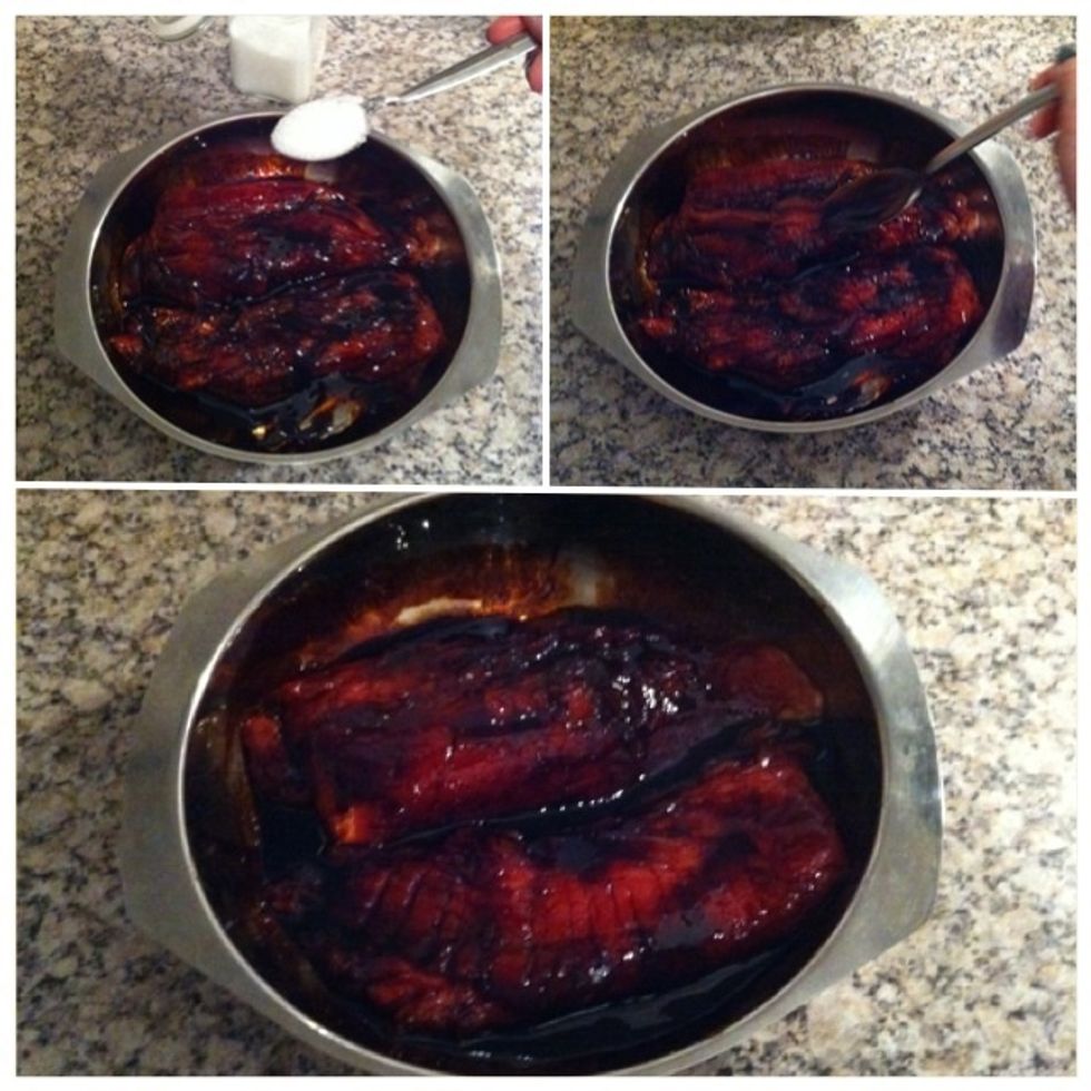 Drizzle 1tsp of sugar on both pieces. Use your spoon to rub the sauce over/into the pork. Repeat this to the other side.