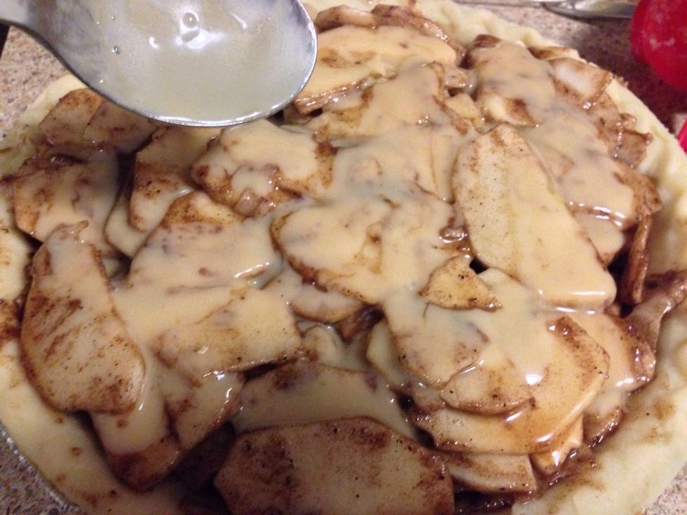Drizzle 4 tbsp of Baileys Butter Sauce over apple pie and set aside the remaining for now. Lightly cover your pie with aluminum foil (shiny side down & do not wrap edges). This prevents over browning.