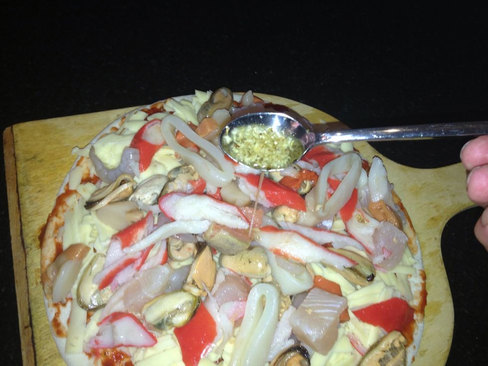 Drizzle a bit of your oil mixture onto the pizza
