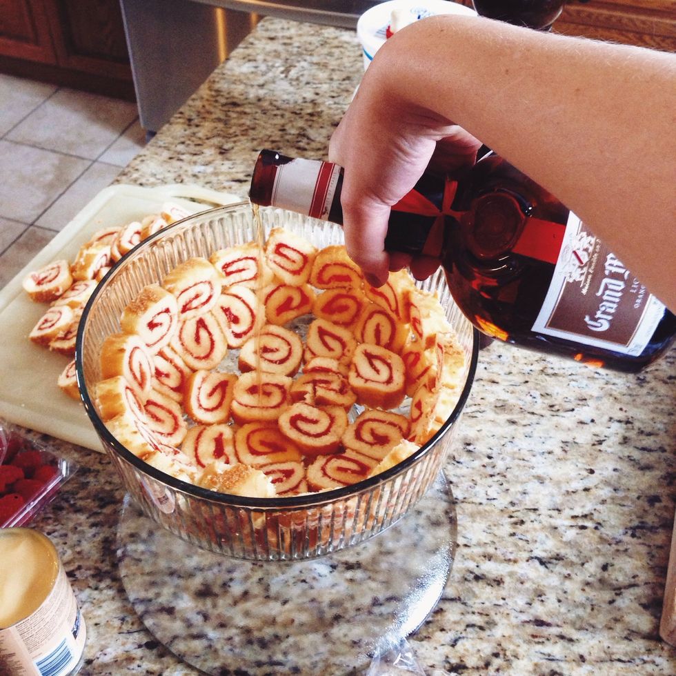Drizzle about 1oz of Grand Marnier over the jelly rolls.