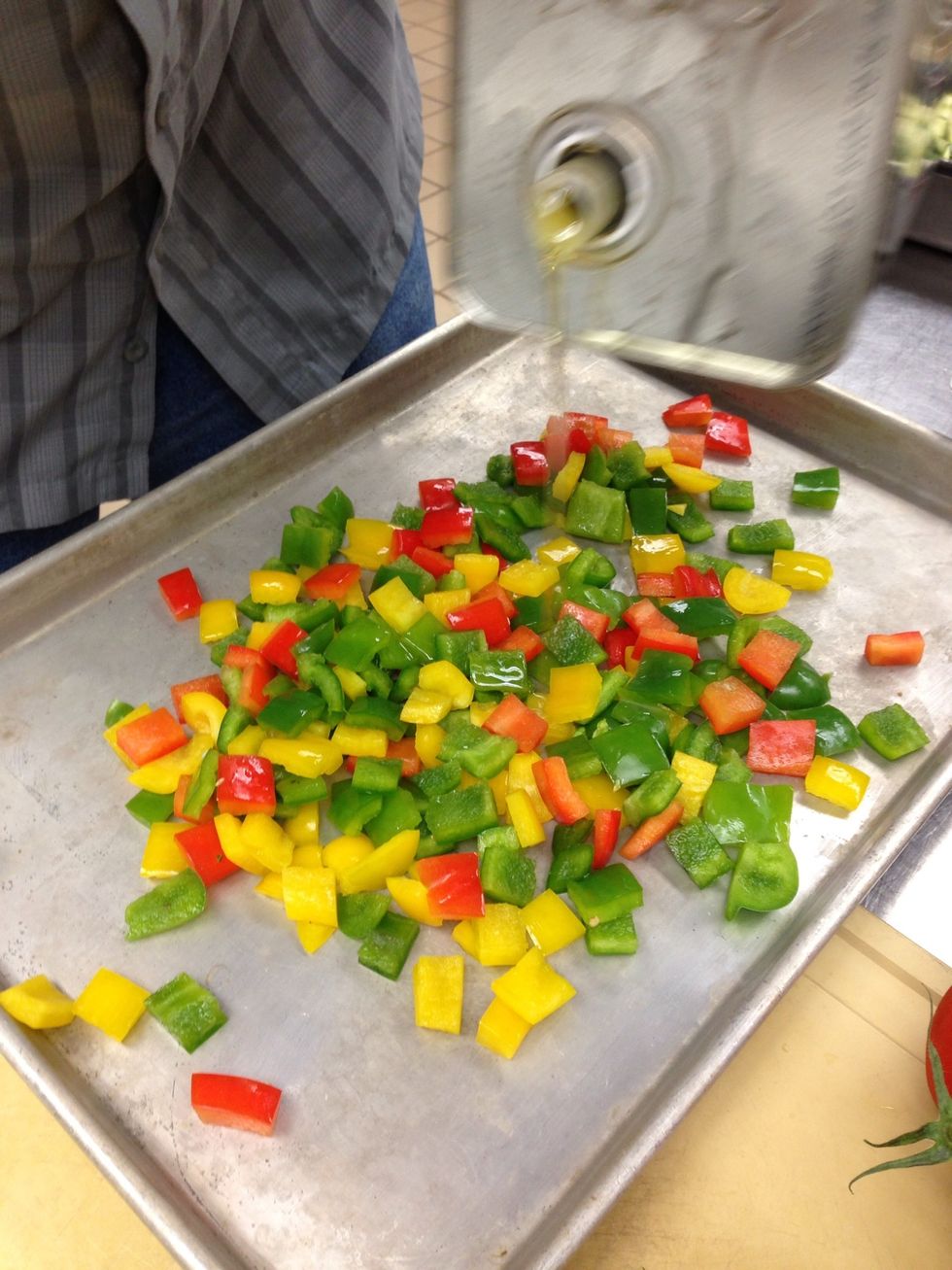 Drizzle bell peppers with olive oil.